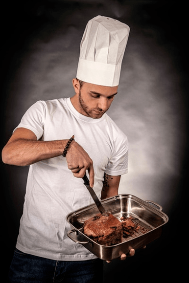 a man prepares meat for power